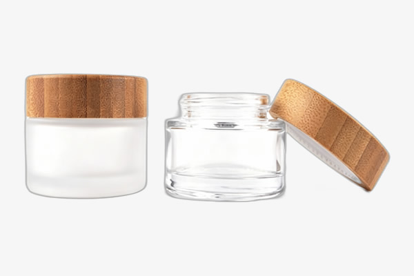 Glass face cream jar with bamboo lid